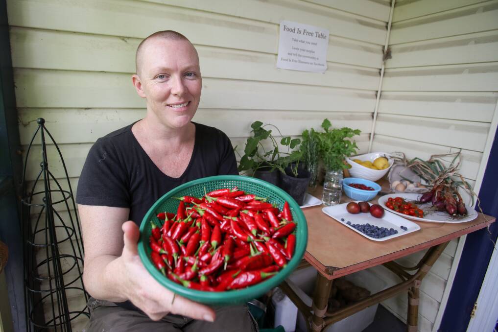 HOT STUFF: Cath Chisholm with her Food Is Free table in Fairy Meadow. There are other tables of free produce in Port Kembla, Figtree, Dapto, Thirroul, Farmborough Heights and Balgownie. Picture: Adam McLean