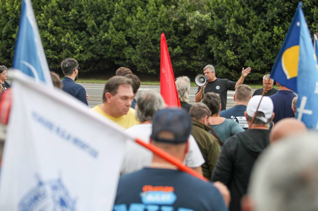 All together: Garry Keane from the Maritime Union of Australia addresses the picket line outside the Port Kembla Coal Terminal, which was bolstered by workers from other industries. Picture:: Adam McLean