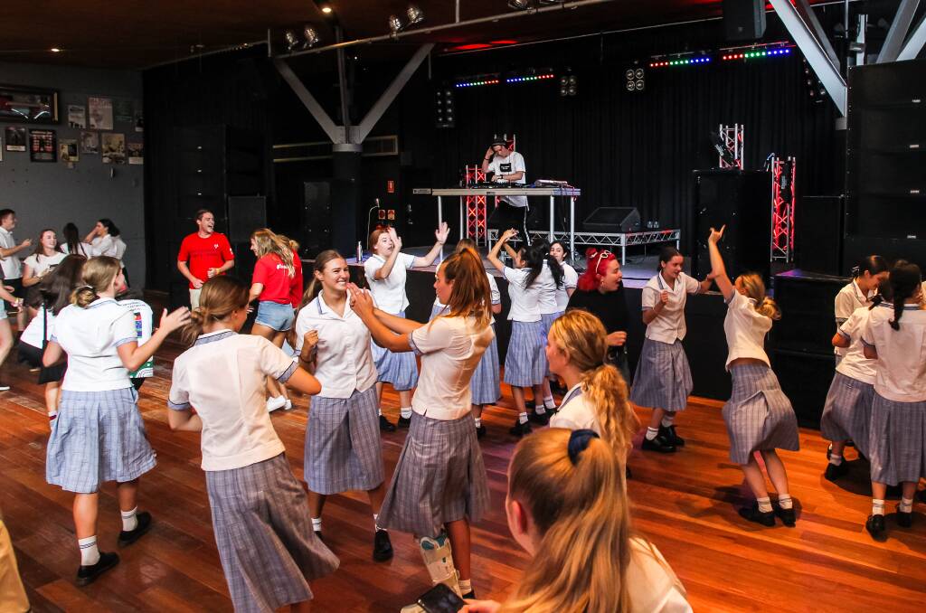 FUN TIMES: High school students take to the dance floor at Wollongong UniBar during UOW's annual Discovery Day. Picture: Anna Warr.