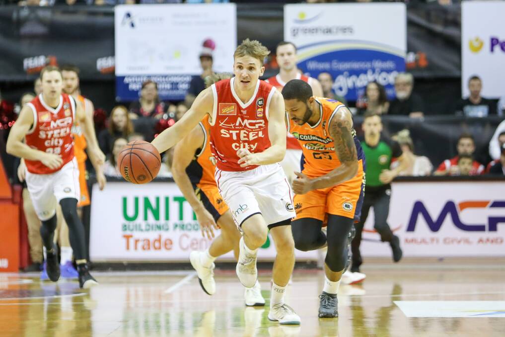 ALL-OUT SPRINT: Illawarra guard Emmett Naar on the fly in the Hawks win over Cairns on Monday that kept their playoffs hopes afloat. Picture: Adam McLean. 