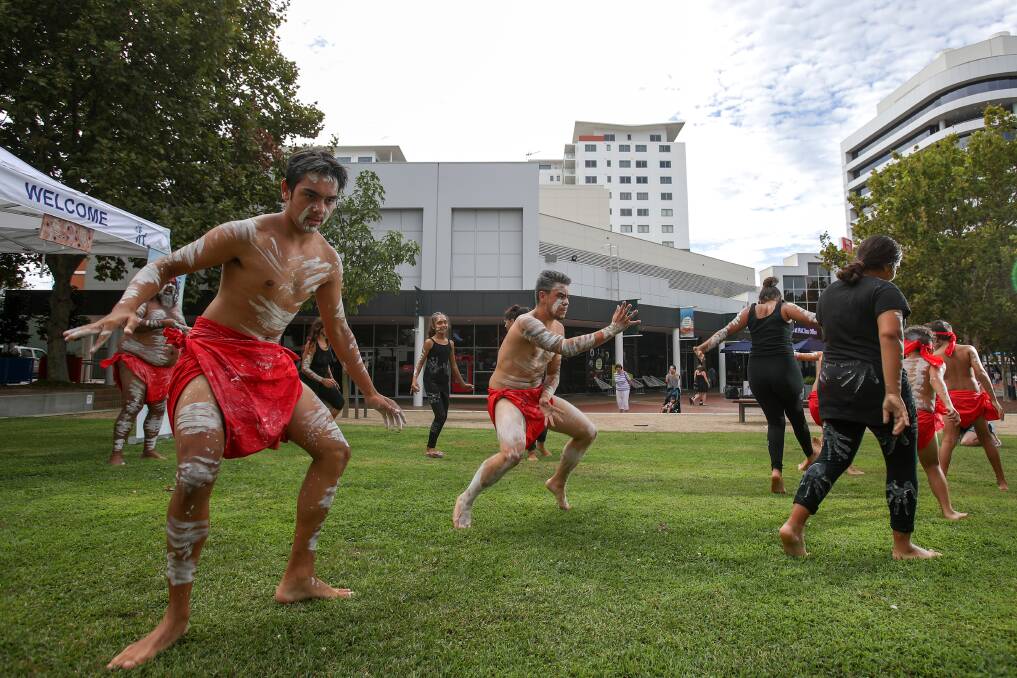 Lenny Wright and Richard Campbell with dancers from the Gumaraa Aboriginal Experience at the Arts Precinct in Wollongong on Wednesday. Picture: Adam McLean