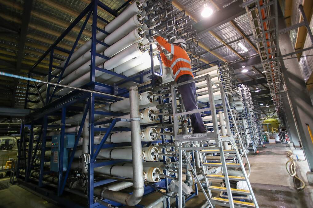A maintenance worker looks for leaks in the reverse osmosis filters at Wollongong's water recycling plant.