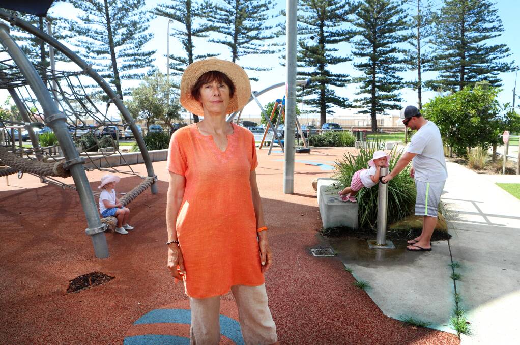 THIRROUL: Heather Carey at the children's playground, where blue stains from the weed killer can be seen along the concrete seams behind her, near the drinking fountain. Picture: SYLVIA LIBER.