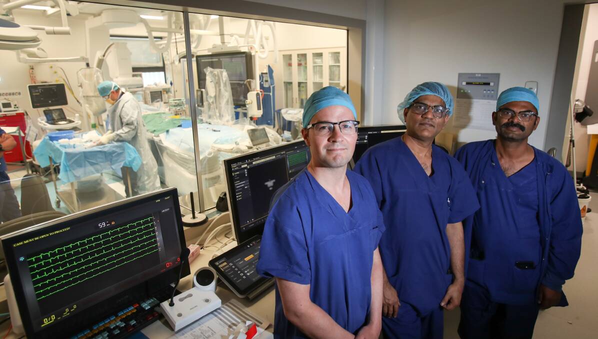 Cardiac surgeons Dr Edward Danson and Dr Pratap Shetty, and anaesthetist Dr Shiva Hampasagar, prepare to undertake a new heart procedure on a patient on Friday. Picture: Adam McLean