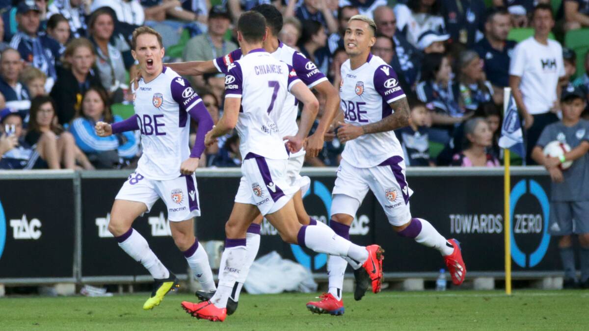 REASON TO CELEBRATE: Perth veteran Neil Kilkenny joins teammates after scoring his penalty against Melbourne Victory at AAMI Park last weekend. Picture: AAP Image/George Salpigtidis