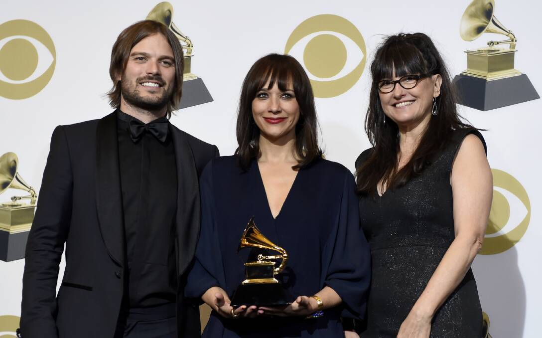 Alan Hicks, Rashida Jones and Paula DuPre Pesmen pose in the press room with the award for best music film for "Quincy" at the 61st annual Grammy Awards in Los Angeles. Picture: AP