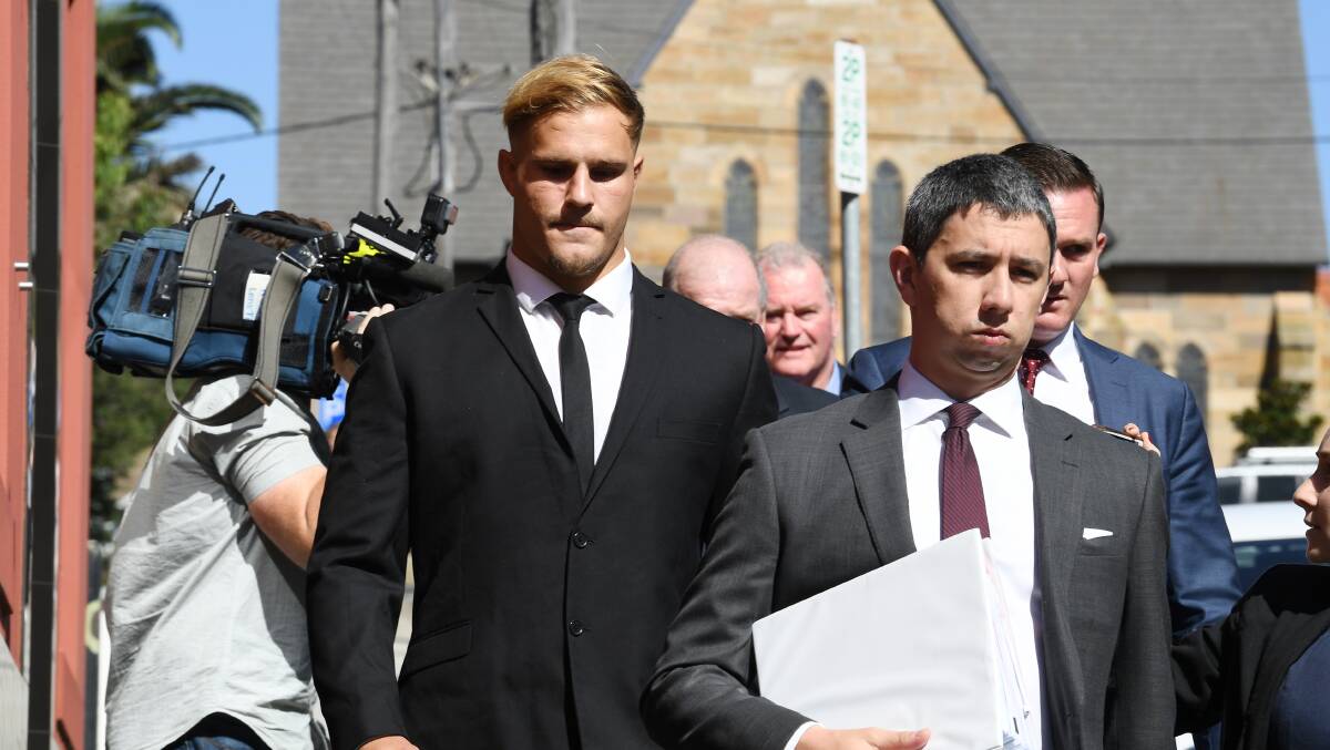 Playing on: St. George Illawarra Dragons player Jack De Belin (left) leaves Wollongong Local Court on Tuesday. Picture: AAP Image/Dean Lewins