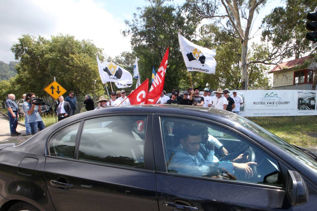 IS THAT HIM IN THERE: Wollongong Coal executives - but not top brass Naveen Jindal - pass the protesting workers about noon on Thursday. Pictures: Sylvia Liber.