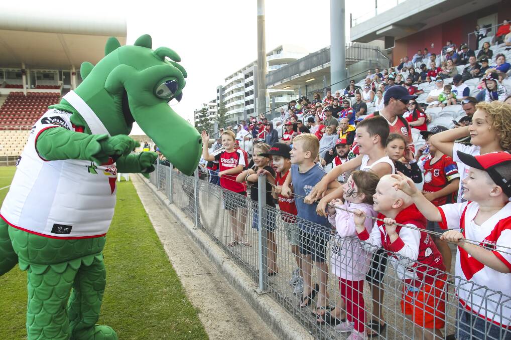 St George Illawarra Dragons fans showing some love for the team mascot. Picture: Anna Warr