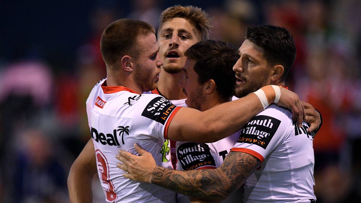 Hit and miss: The Dragons celebrate a try against Souths in the Charity Shield. Picture: AAP Image/Dan Himbrechts