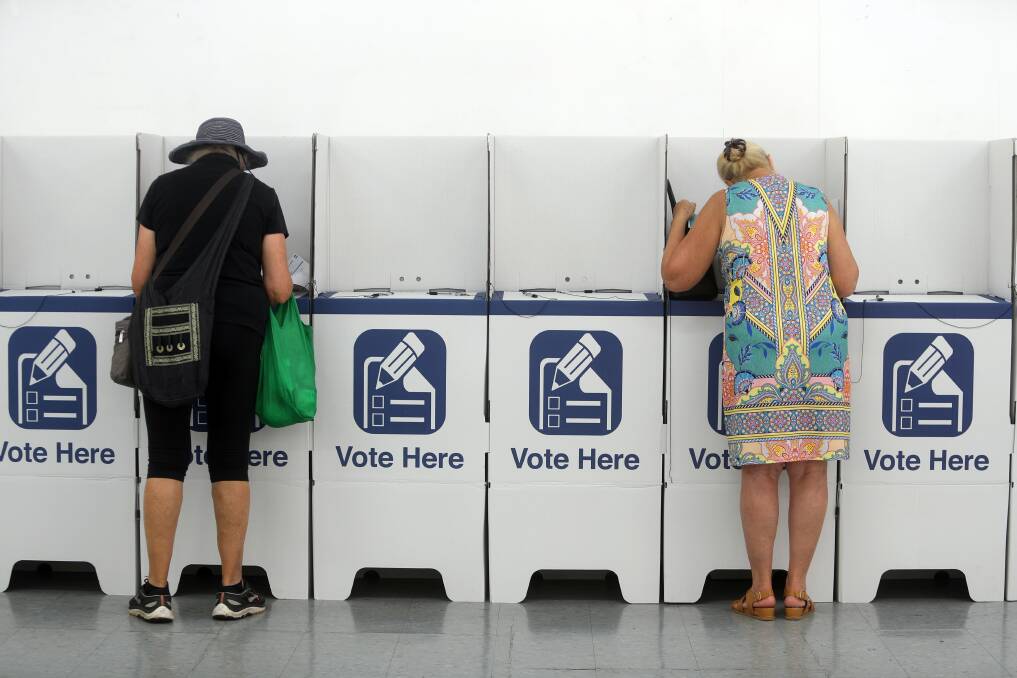 People casting an early vote in the 2019 state election .... the numbers of Illawarra residents who wait until election day to vote are declining. Picture: Robert Peet