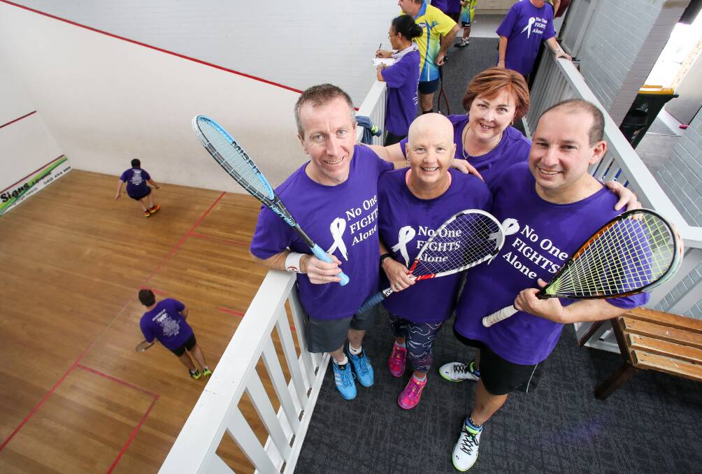Illawarra squash member Troy Mountford, Alison Voller and Wally Guerreiro at Dapto Squash Centre with Carol Loy, who is being treated for non-Hodgkin lymphoma. Picture: Adam McLean