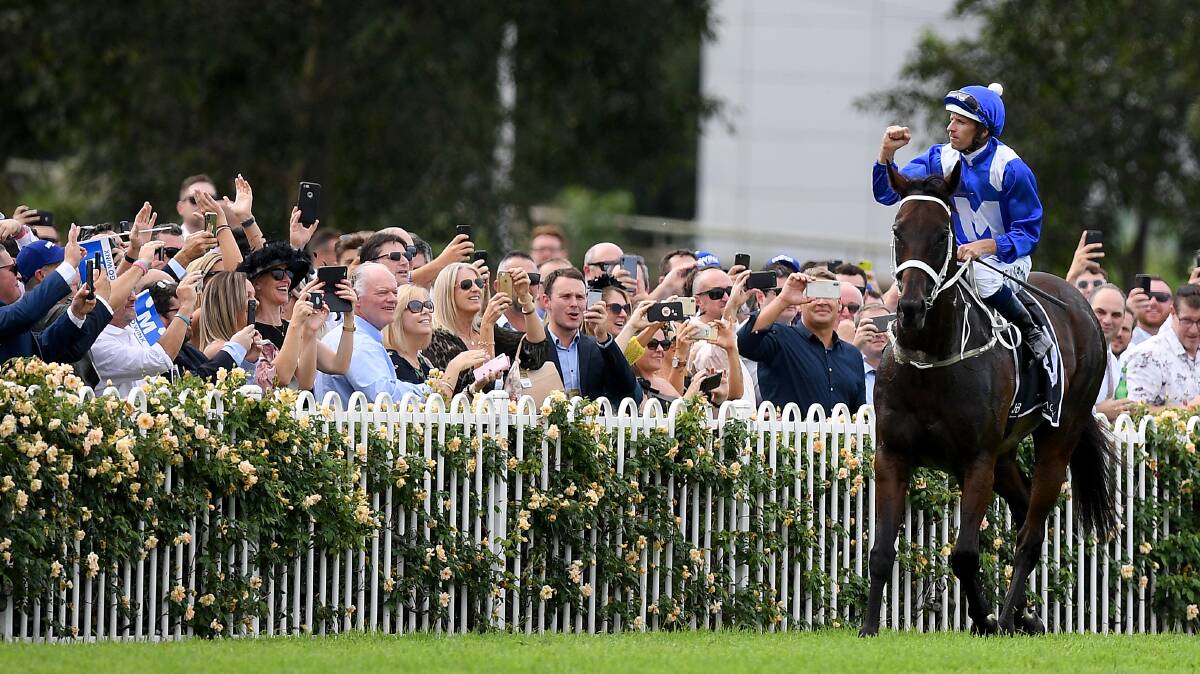 One last time: Hugh Bowman celebrates on Winx after winning the George Ryder Stakes last month. Picture: AAP Image/Dan Himbrechts