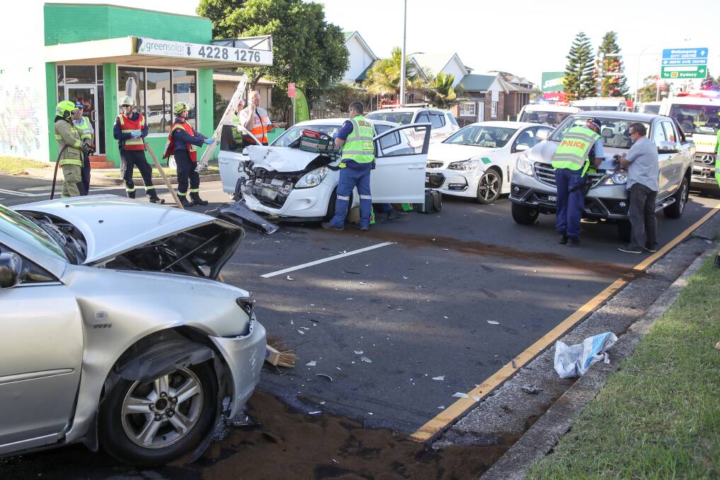 A woman was trapped in the Hyundai (centre) after a collision with the silver Camry (left). Four people were taken to hospital after the crash. Picture: Adam McLean
