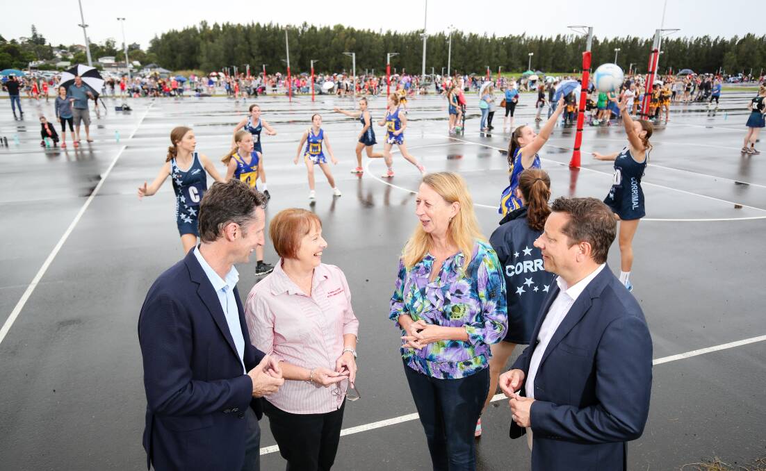 Funding: Labor's Stephen Jones, Sharon Bird and NSW MP Paul Scully discussing concerns with Illawarra netball president Dainne Elvy (second from left) at a gala day at Fred Finch Park last month. Picture: Adam McLean