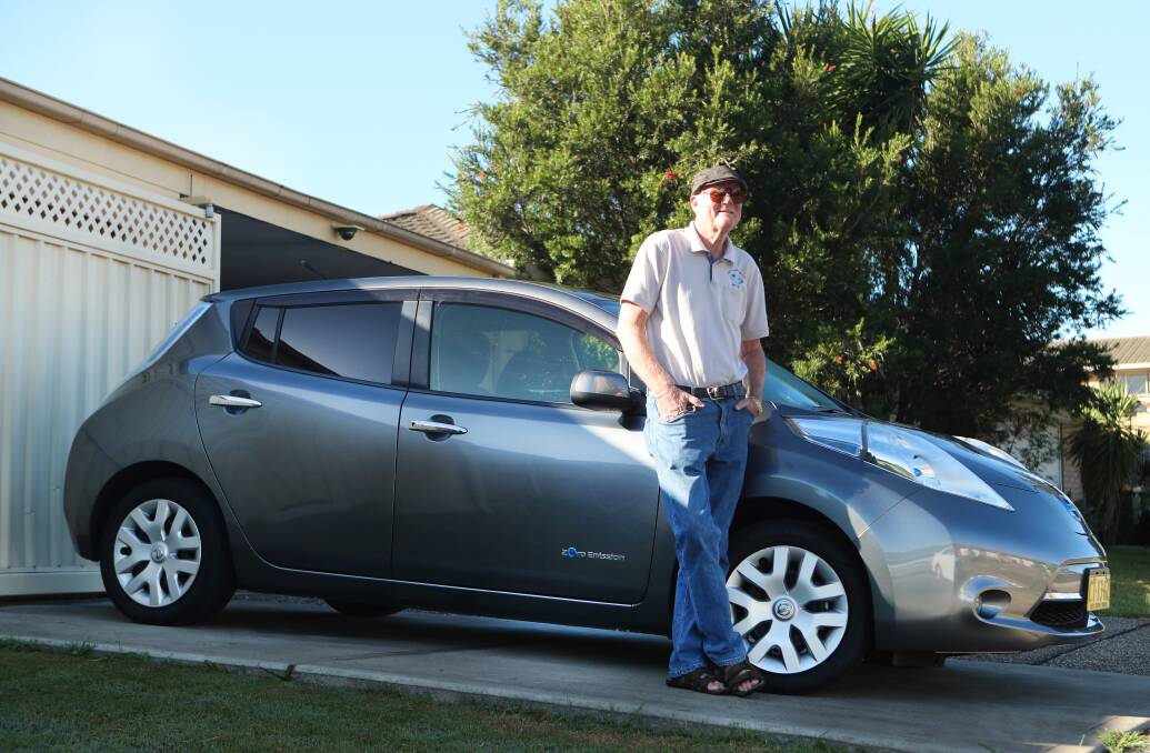 COST SAVER: Tony Kent loves his new electric car which charges itself when going down a hill. Otherwise its 30 minutes on a charging station. His wife Helen says the Nissan 'goes like a rocket'. Picture: Sylvia Liber