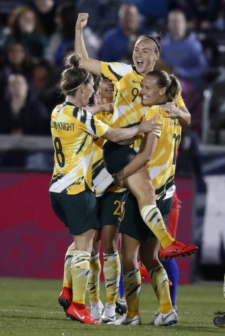 Cup crusade: Caitlin Foord celebrates a goal against the US this year. Picture: AP Photo/David Zalubowski