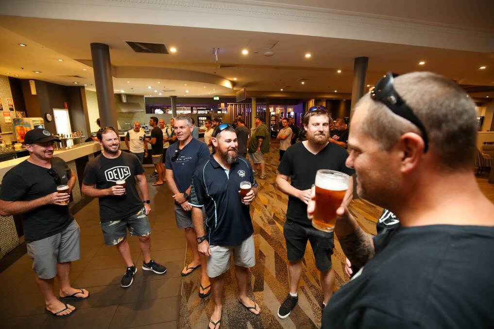 Finally: Port Kembla Coal Terminal workers celebrate with a beer after voting to accept a new pay deal that includes the job security clause they wanted. Picture: Adam McLean