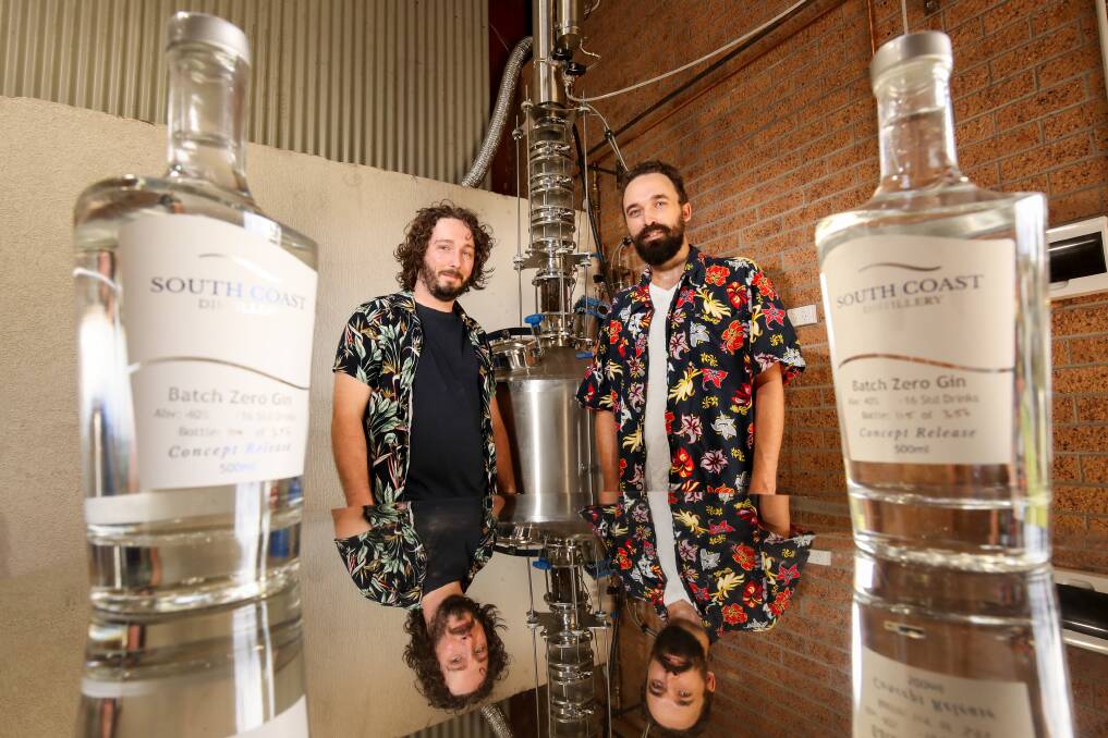 Cheers: South Coast Distillery co-founders Luke Harding (left) and Oskar Schwab with their award-winning gin. Picture: Adam McLean