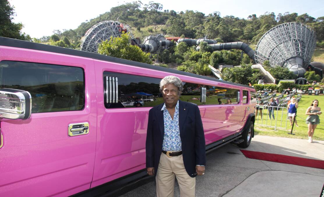 Special guest performer Kamahl arrives in style at the Jamberoo Take Action festival. 