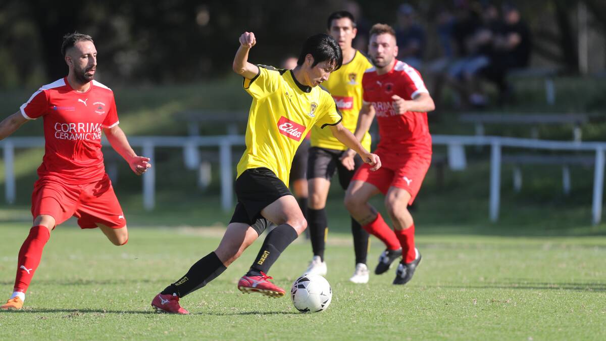 BIG RESULT: Coniston's Taka Kamano holds possession against Corrimal Rangers at JJ Kelly Park. Picture: Robert Peet