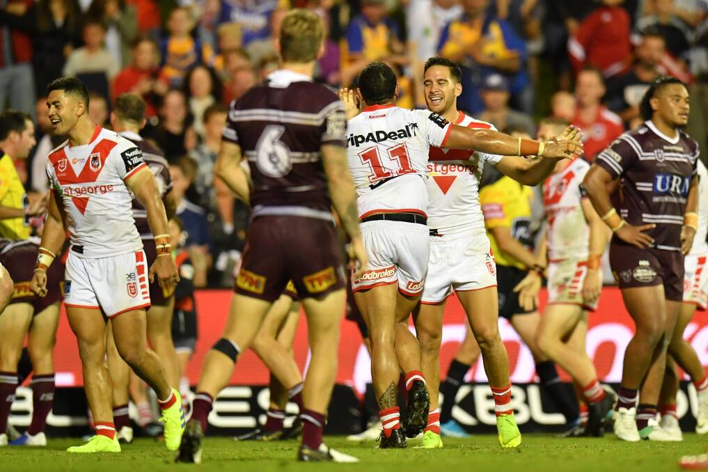 HOW GOOD: The Dragons celebrate the match-winner on Saturday night. Picture: AAP 