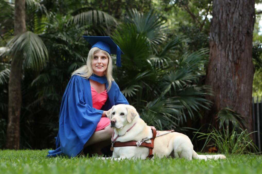 Working together: Kimberlee Brooker with her guide dog Toffee who has been by her side throughout her university studies. Picture: Sylvia Liber
