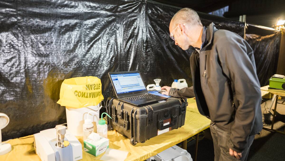 Pill Testing demonstration before Groovin the Moo on April 27, 2019. Senior pill testing chemist Mal Mcleod deomstrates how a pill might be tested with the equipment they have. Photo: Dion Georgopoulos