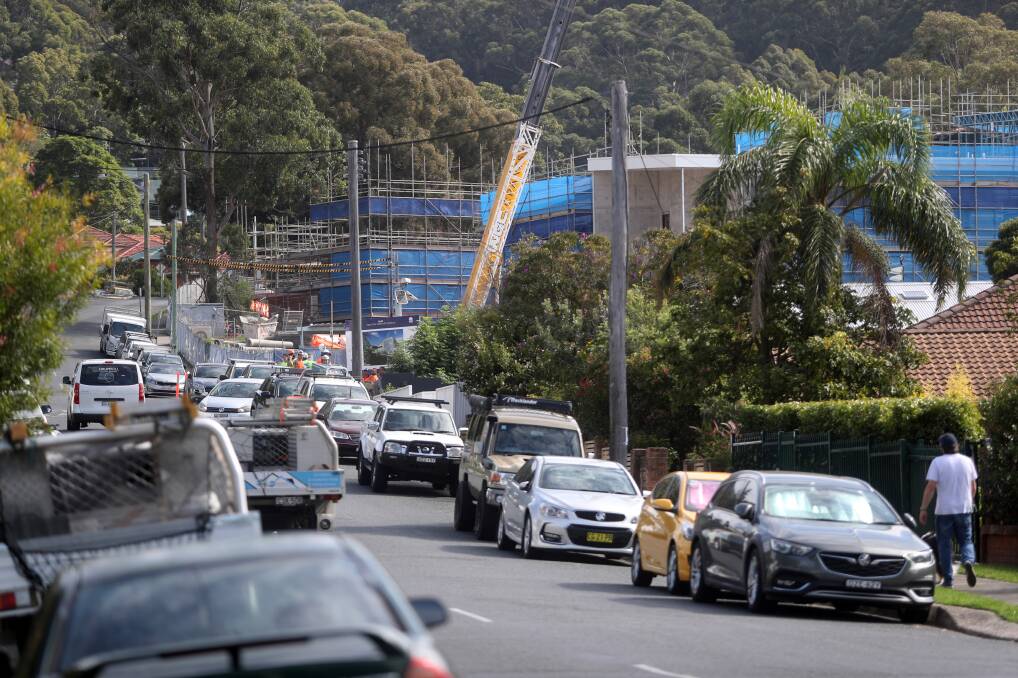 Bulli residents claim there's been parking and traffic chaos on Hospital Road since construction started on the aged care centre. An incident between a resident and worker this week has left them shocked. Picture: Robert Peet