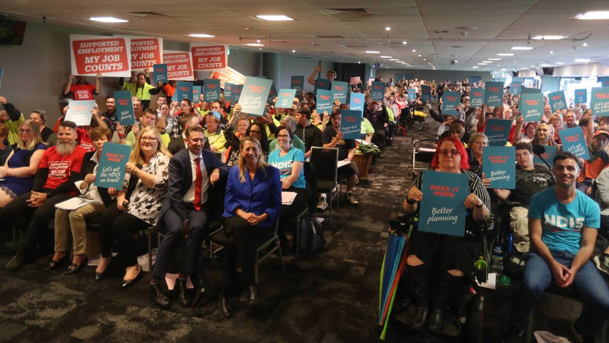 Full house: NDIS participants, carers, service providers, workers and supporters packed the WIN Stadium's Premier Room for a rally held as part of a National Day of Action to fix the scheme. Picture: Robert Peet