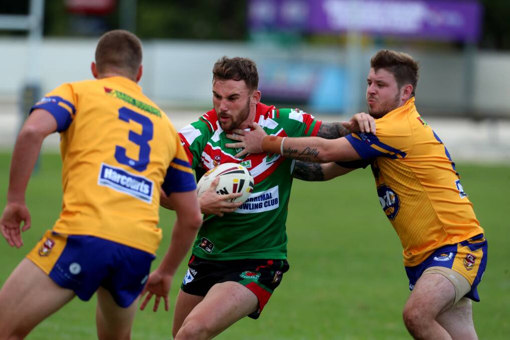 UP FOR THE FIGHT: Corrimal winger Jake Eccleston takes on the Dapto defence on Saturday. Picture: Sylvia Liber