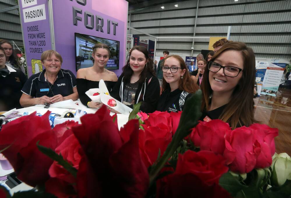 Collette Rixon from TAFE NSW with Taylor Montero, Chloe Smith, Kimberley Lyons and Renee Goodall at the TAFE NSW floristry stand. Picture: Robert Peet