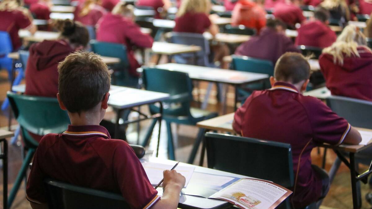 OLD SCHOOL: Year 7 Dapto High School students doing their NAPLAN test with pen and paper on Wednesday. Picture: Adam McLean