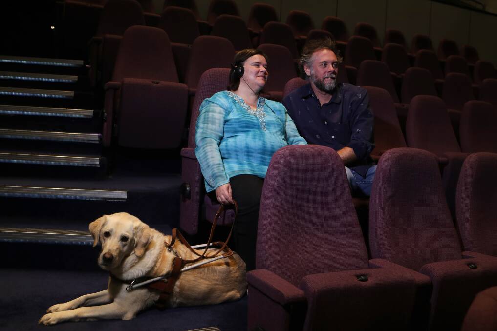 Access all areas: Audio descriptions and tactile tours add to the experience for Samantha Noonan, pictured at the Illawarra Performing Arts Centre with guide dog Sheba and Merrigong's Leland Kean. Picture: Sylvia Liber