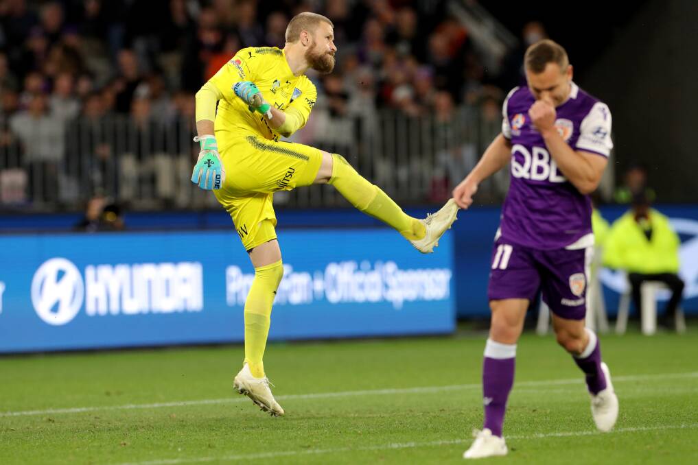 Heartbreak: Andrew Redmayne kicks the ball after saving Brendon Santalab's penalty attempt in the A-League grand final. Picture: AAP Image/Richard Wainwright