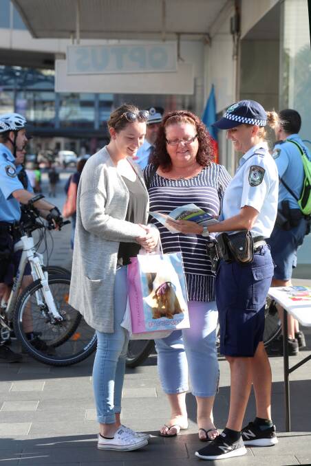 Senior Constable Sharon White chatting with Tyrah Oliveira and Robyn Oliveira at the Crime Stoppers public address in Wollongong's Crown Street Mall. Picture: Sylvia Liber