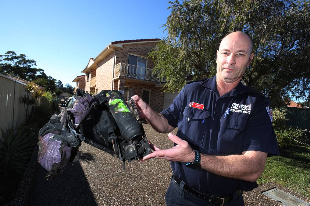 Andrew Erlick from NSW Fire & Rescue with the fire damaged portable gas burner which caused a unit fire in Pur Pur Avenue Lake Illawarra. Picture: Robert Peet