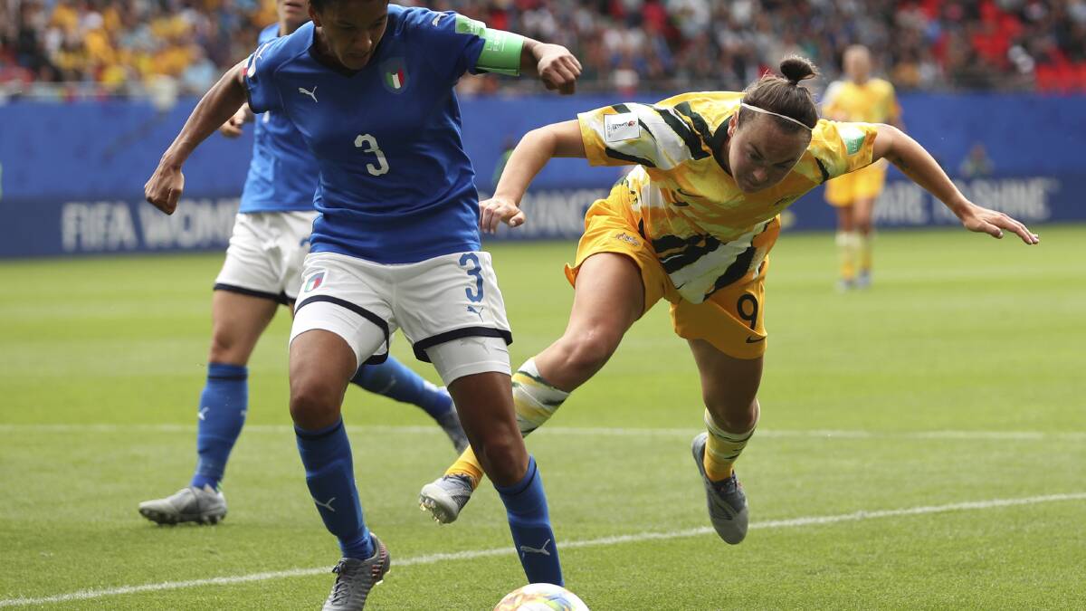 Difficult night: Caitlin Foord challenges for the ball in the Matildas loss to Italy. Picture: AP Photo/Francisco Seco.