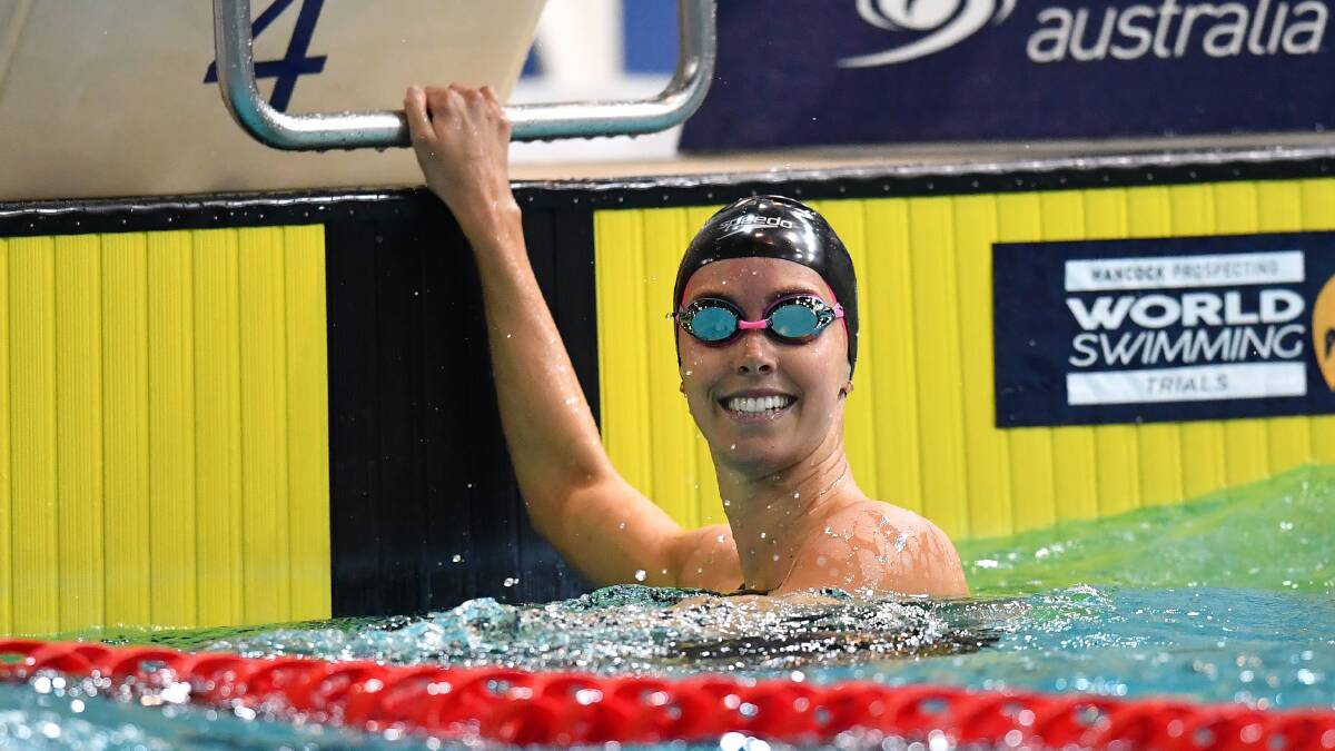 Finding form: Wollongong's Emma McKeon is all smiles after winning the 200m freestyle world title qualifier. Picture: AAP Image/Darren England