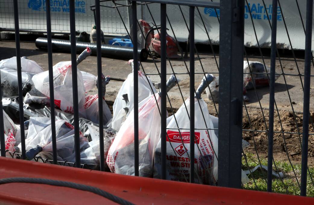 SAFE DISPOSAL: The asbestos material was bagged for disposal. Picture: Sylvia Liber. 