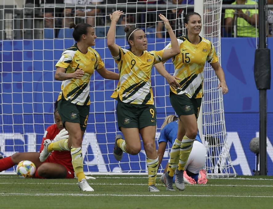 On target: Caitlin Foord celebrates after scoring the Matilda's first goal in a 3-2 win over Brazil. Picture: AP Photo/Claude Paris
