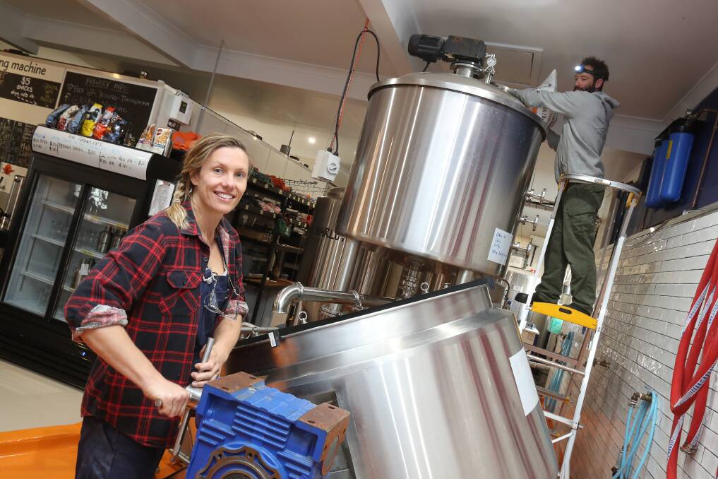 Reub Goldberg Brewing Machine's Anna Suthers and Billy Barnetson get ready for next weekend's live brew event at the Tarrawanna brewery. Picture: Robert Peet