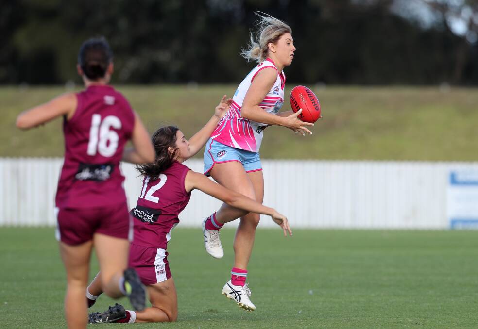 In front: Eleri Morris marks for the Wollongong Saints on Saturday. Picture: Robert Peet