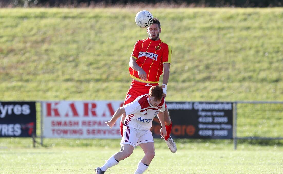 United front: Kane Wright rises for a header against Albion Park earlier this year. Picture:: Adam McLean