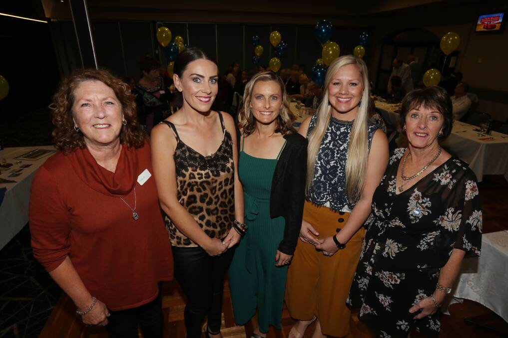 Celebration: Dapto Netball Club life member Maria Agnew (left) with current players Sarah Roche, Jayne Creighton and Leah Price and life member Coleen Randall at the club's 50th anniversary dinner. Picture: Robert Peet.