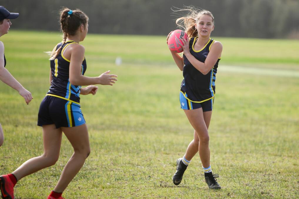 Safe pair of hands: Lily Murdoch runs with the ball. Picture: Adam McLean.