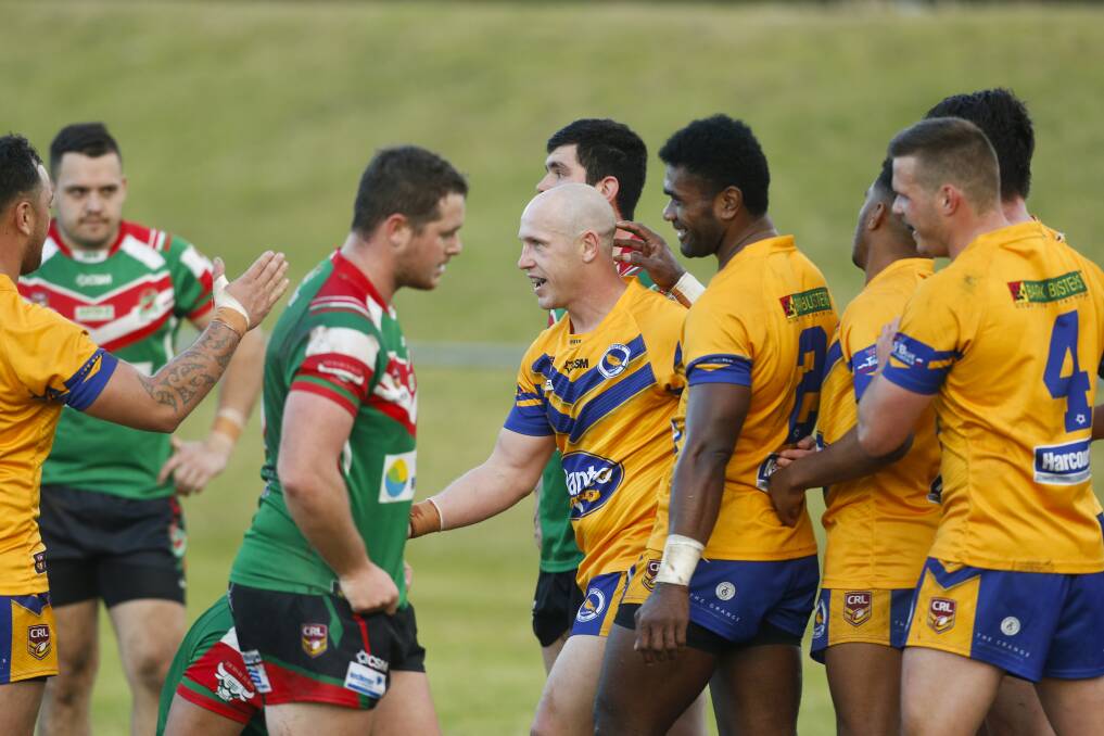 FOUR-POINTER: Dapto celebrate Jeff Robson's try against Corrimal on Saturday. Picture: Anna Warr