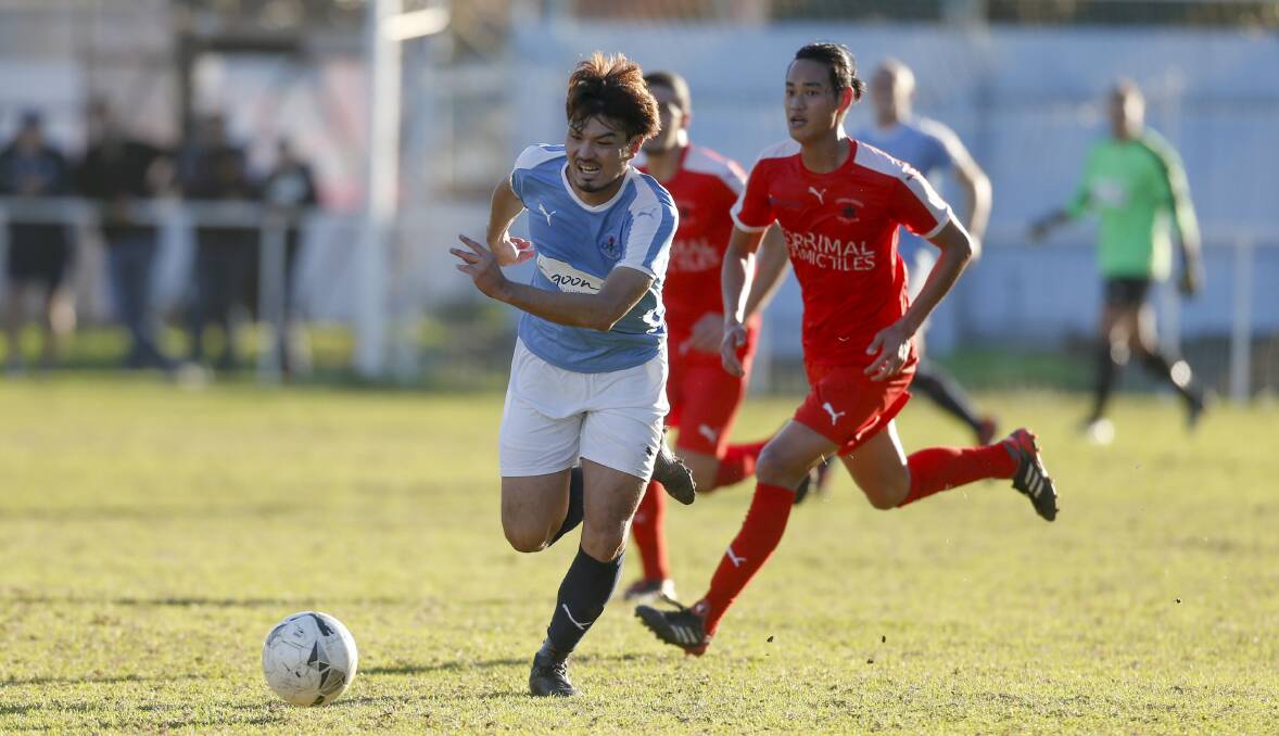 Lead the charge: Olympic's Yusuki Ueda in the 2-nil win over Corrimal on Saturday. Picture: Anna Warr