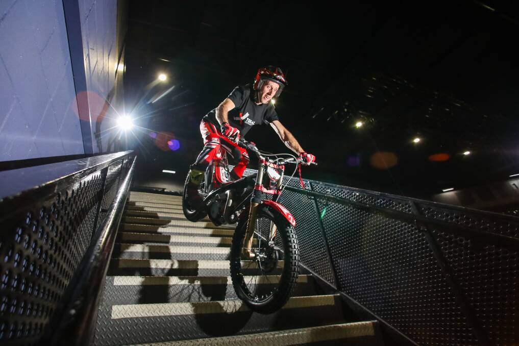 Neil Price doing motorbike stunts at WIN Entertainment Centre to promote the X Trial Australian Championship on July 27. Picture: Adam McLean