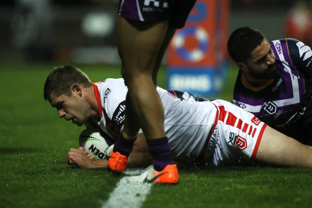 OVER: Jeremy Latimore scores the opening try against Melbourne on Thursday night. Picture: Sylvia Liber
